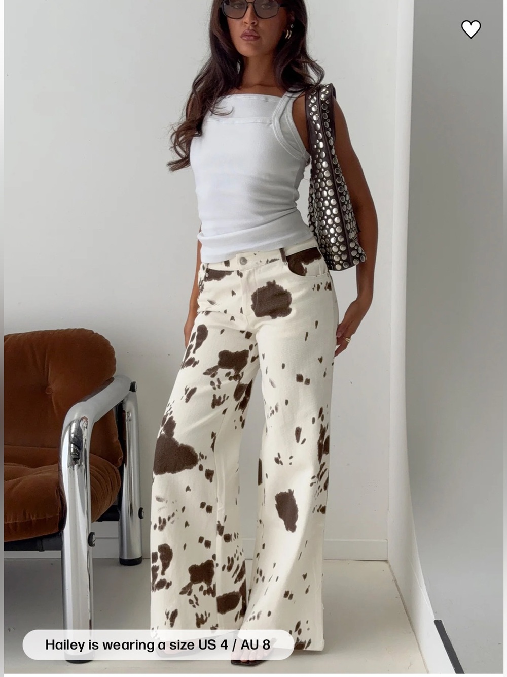 PRINCESS POLLY cow print wide leg jeans.